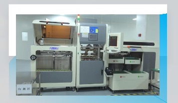 Company-supplied photograph of automated PCB test equipment